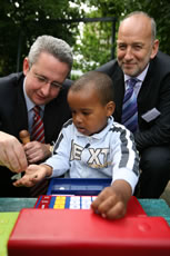 Ivan Lewis helps one of the children 