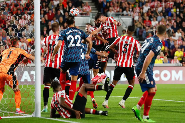 Christian Norgaard rises above the Arsenal defence