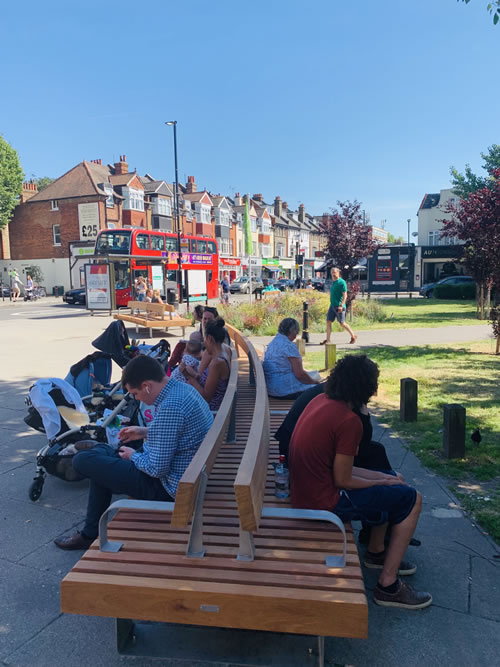 people sit on benches