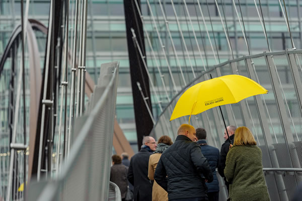 crossing footbridge in the rain 