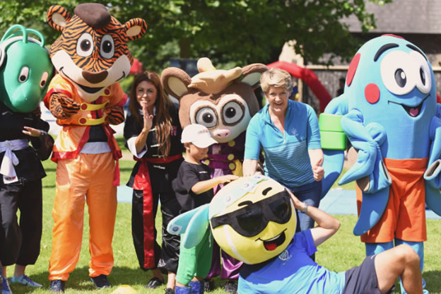 Clare Balding with mascots in super saturday of sport event 