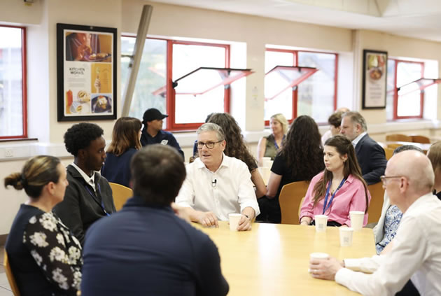 The Prime Minister chats with apprentices at Acton Works. Picture: Simon Dawson / No 10 Downing Street