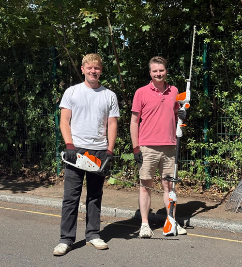 Cllrs Linden Grigg and Jack Emsley cleaning up