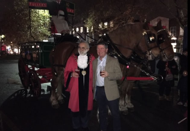 the mayor with a pint of beer