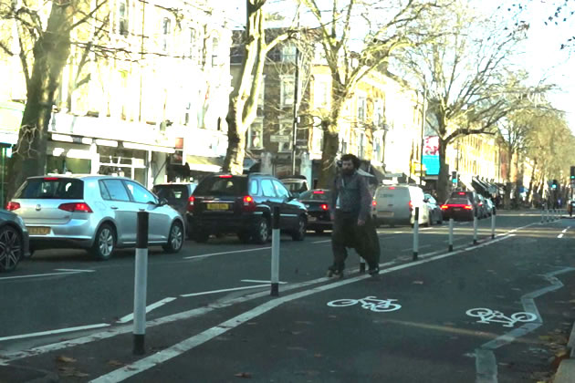 Roller blader makes use of the cycleway for slalom practice