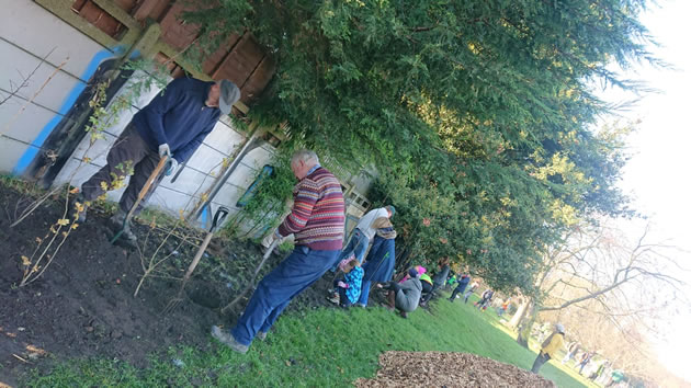 sam hearn and group planting trees