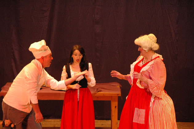 Spoons and Cookie try to cheer up Snow White in the group's 2009 production of Snow White
