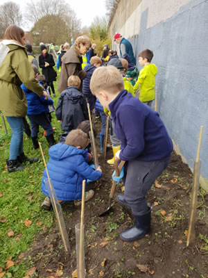 children planting trees