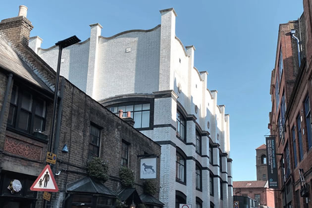 Voysey House with the Lamb pub in the foreground