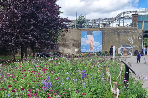Last chance to see the upside-woman on Turnham Green Piazza 