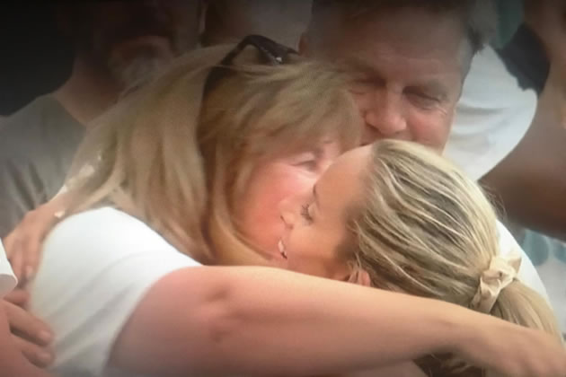 Georgia embraces her family after the race