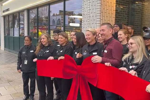 Store manager Dan Talmedge officially opened the store with colleagues