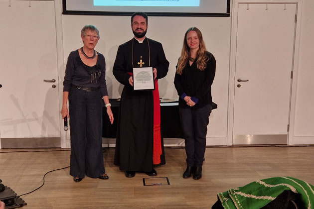 A representative of St Mary’s Cathedral (centre) receives a Commended certificate