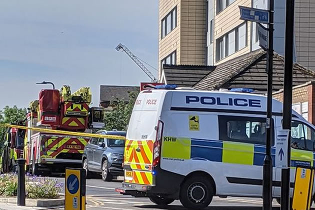 Police block the road at the time of the fire