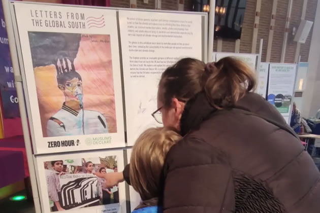 Attendees look at the displays at a previous exhibition of the letters 
