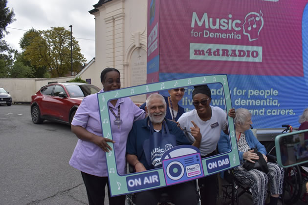 Staff and residents help celebrate the launch of the new radio station 