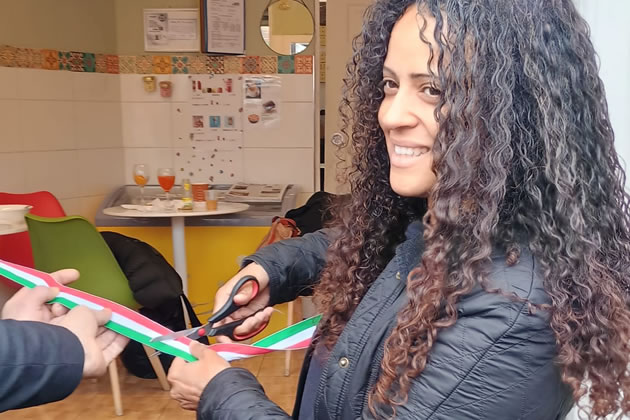 Stefania D'Orsi cutting the ribbon at the Double Grand Opening