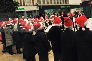 Schoolchildren sing carols in Hammersmith