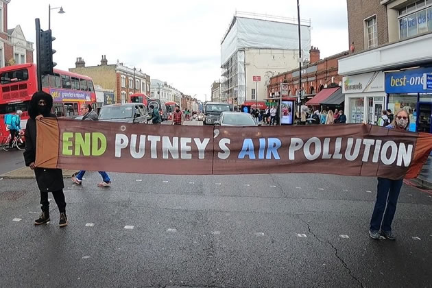 Protestor hold 'Green Man Swarm' on Putney High Street 