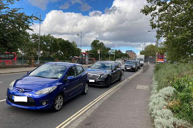 Cars Queuing Down Manor Road