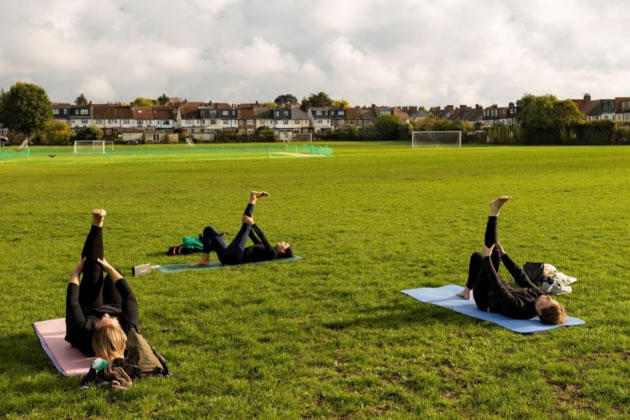 Yoga in Roehampton Playing Fields.