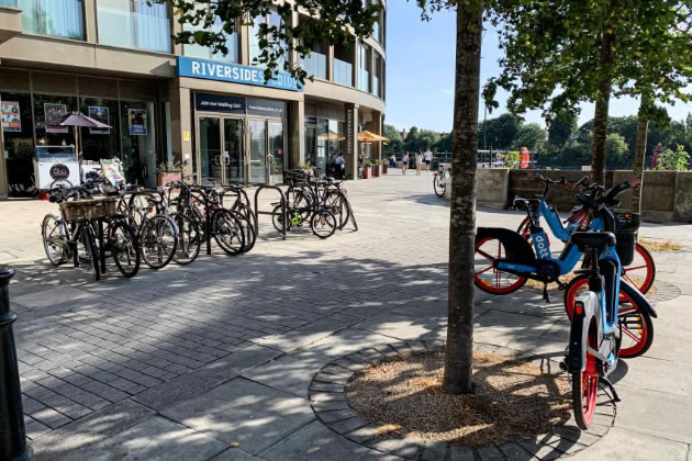 Electric bikes parked outside of Riverside Studios, Hammersmith