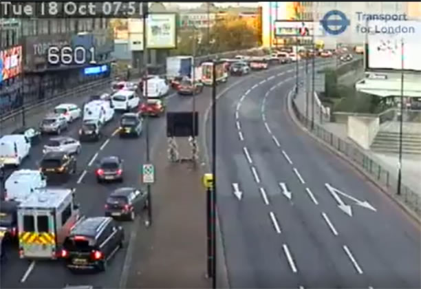 An emergency services vehicle tries to navigate through the resulting traffic jams