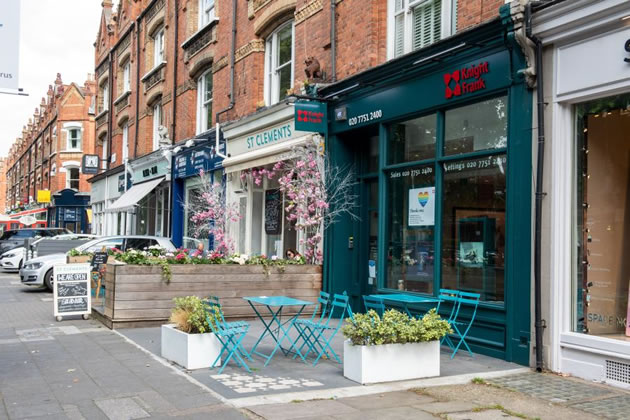 Chairs and tables on the street outside St Clements cafe