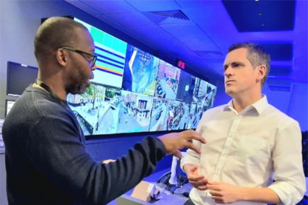 Councillor Hogg being briefed by control room manager Anthony Carter